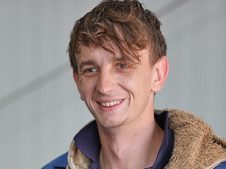 Young mechanic smiling, portrait
