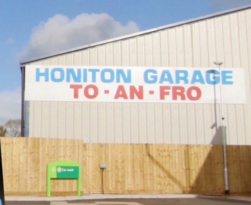 The Honiton Garage and To-An-Fro sign on our building at Turks Head
